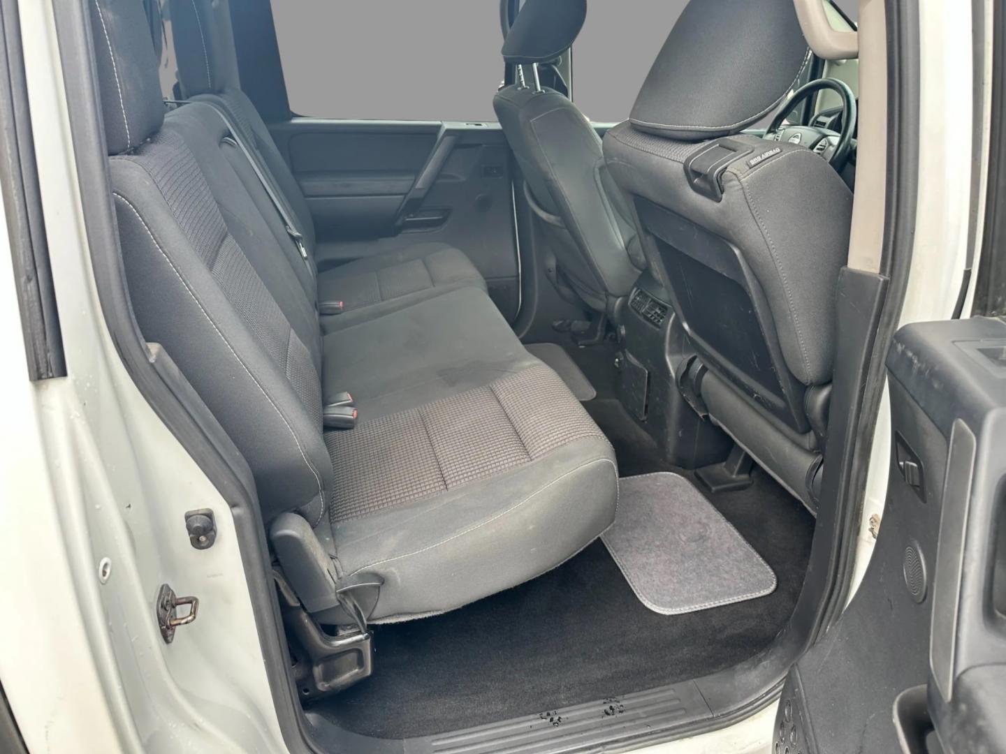 2013 White /Black Nissan Titan Pro-4X (1N6AA0EC0DN) with an 5.6L DOHC 32V V8 engine, Automatic transmission, located at 547 E. Main St., Orwell, OH, 44076, (440) 437-5893, 41.535435, -80.847855 - This 2013 Nissan Titan Pro-4X Crew Cab is a capable and well-equipped full-size pickup truck. It features a powerful 5.6L Endurance V8 engine paired with a 5-speed automatic transmission, a locking rear differential for improved traction, and a maximum towing capacity of 9,300 pounds. The truck is l - Photo#27